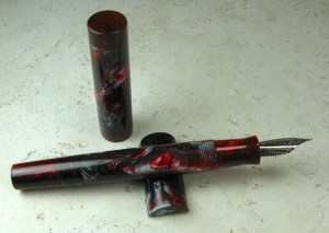 Chronicler, clipless, in Silver Ruby Lava Lamp #33 and Double Ruby alumilite section and finials