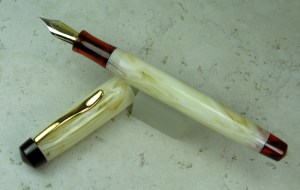 Custom Muse (with no step from threads to barrel) in Alabaster Swirl acrylic and Ruby Tortoise lucite