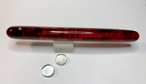 Extended Zephyr in Red Amber Lucite with 18k Iota Roll Stop - Large
