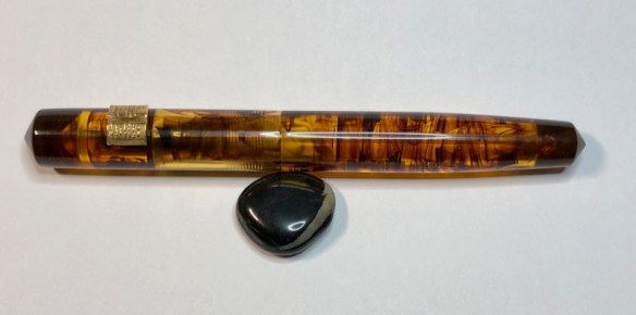 Idyll in Brown Tortoise Lucite with Open Book Roll Stop in Bronze - Medium