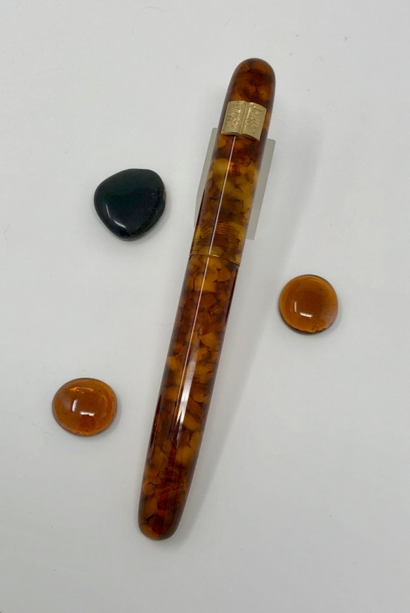 Custom Zephyr in Illuminated Amber Tortoise with Open Book Roll Stop